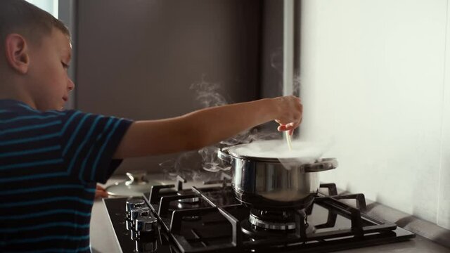 A little boy prepares a magic potion