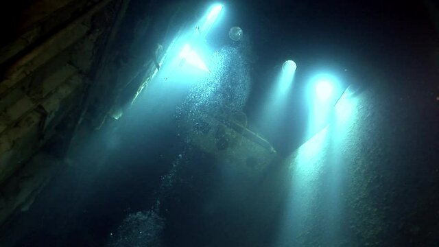 Ship wreck Salem Express underwater in the Red Sea in Egypt. Extreme tourism on ocean floor in world of coral reefs, fish, sharks. Researchers of wildlife blue abyss. Deep diving.