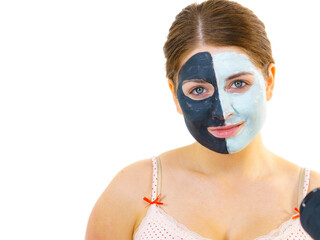 Girl with black white mud mask on face