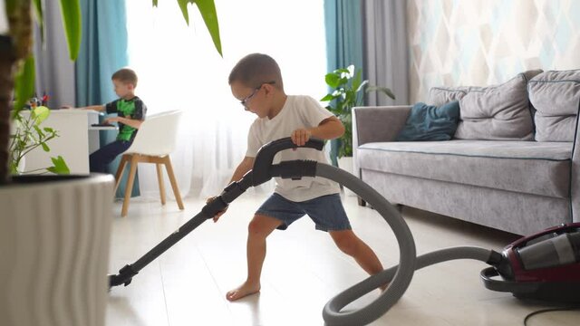 Housework children help. Child cleaning floor at home.