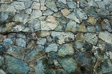 stone background. creative gray texture. colored mosaic. wall made of slabs.