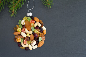 Christmas ball made of mix nuts and dried fruit, baking christmas background concept 