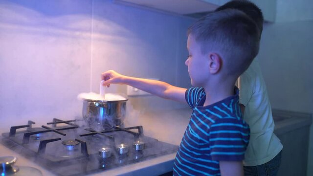 A little boy prepares a magic potion