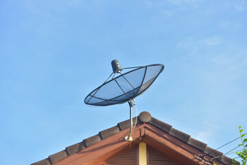 Technology communication tower ,TV Antenna with satellite dish at blue sky background.