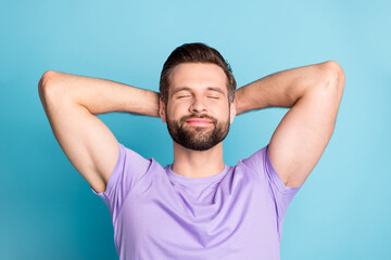 Top above high angle view photo of young attractive man enjoy free time rest relax hands behind head isolated over blue color background