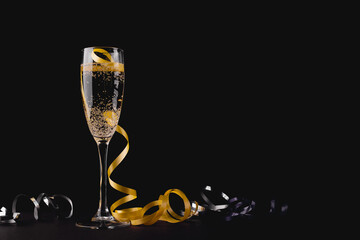 Glass of champagne and yellow ribbon