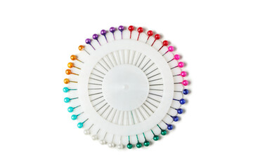 Multi colored needles isolated on white background