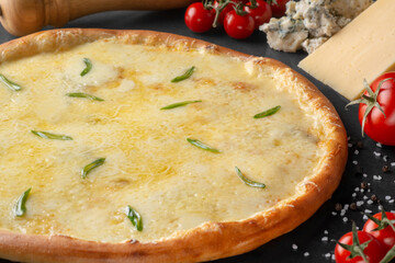 pizza on black background with ingredients