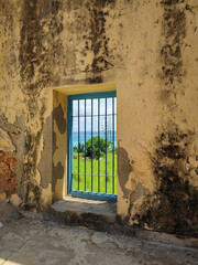 Ocean view from the prison window with lattice