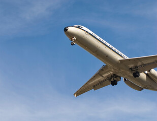 airplane flying in the blue sky, prepares for landing