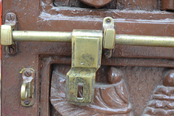 An old door with lock handle.