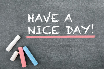 Have a nice day. Greetings, inspiration and good wishes. Gray chalk board background
