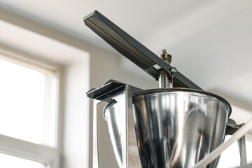 Close up of industrial metal juicer appliance
