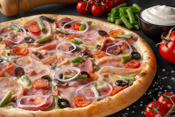 pizza on black background with ingredients