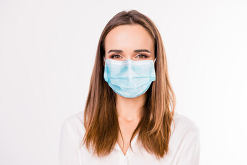 Close up formal portrait of successful woman wearing blue face mask isolated on white colored background