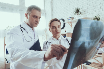 A man with a stethoscope in a white coat. 