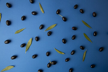 black olives, on blue background