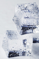 Naklejka na ściany i meble Blocks of Ice With water Drops close-up.