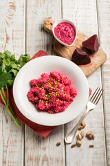 pasta with beet pesto and pistachio nuts