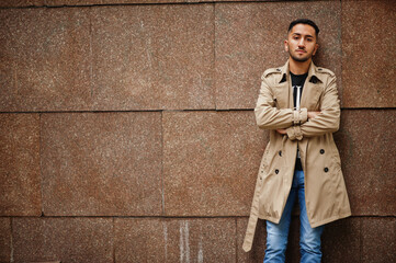 Stylish kuwaiti man at trench coat.