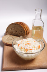 Sauerkraut. Fermented vegetables. Sunflower oil. On a white background. Russian kitchen.