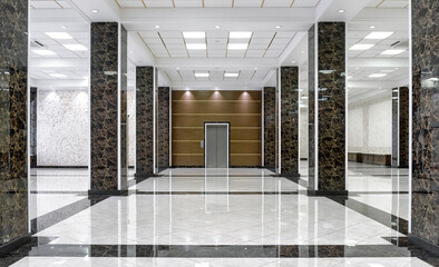 Clean floor in commercial lobby, marble shiny tiles in office hall