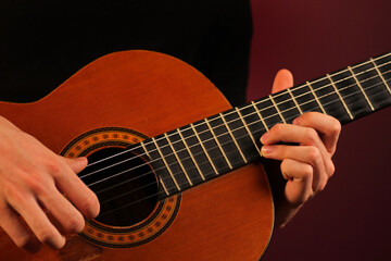 Fototapeta na wymiar Person playing classic acoustic guitar