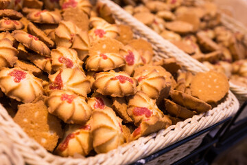 crispy cookies in wicker baskets on the counter