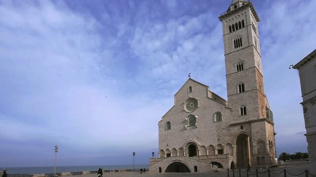 Blue hour in cathedral square, Trani. The cathedral of Trani, San Nicola pilgrim, stands in the town square overlooking the sea
