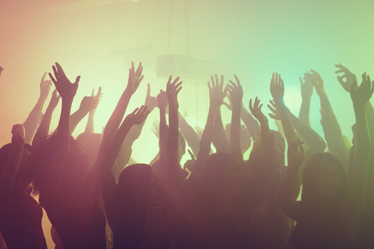 Photo of meeting careless dance having fun party raise hands neon light wear stylish outfit modern club indoors