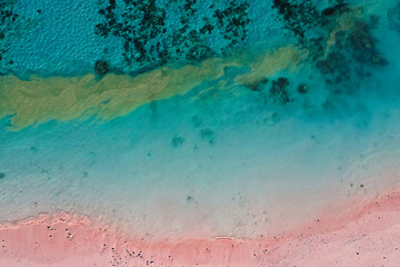 Obraz na płótnie Canvas Top view of blue ocean with pink sandy beach at Flores island, Copy space