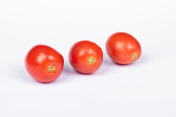 three tomato on white background