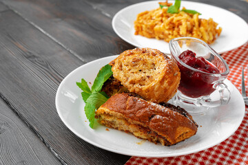 Georgian baked sweet nut roll with berry sauce