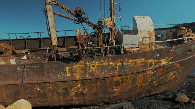 Abandoned ship on the shore of the Barents sea on the Rybachy Peninsula, Russia. Smooth camera movement.