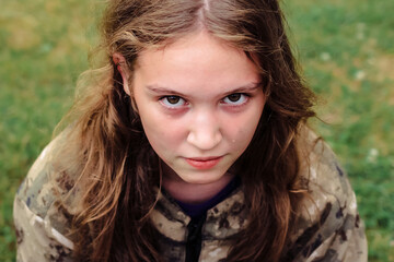 Naklejka premium A teenage girl crying after playing laser tag game. Emotions, tears and sadness. The concept of winning and losing the game.