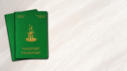 two vanuatu passports on white wood background , space for texts