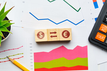 Currency exchange concept with paper charts and reports
