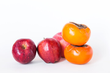 Fototapeta na wymiar Fresh Persimmon fruit and red apples isolate on white background