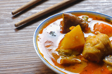 Dalcha in the plate on the table.