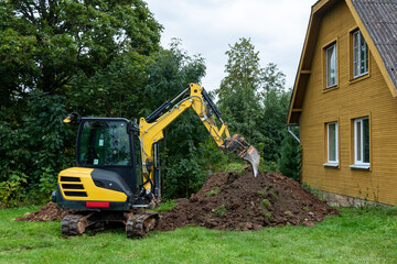 Fototapeta na wymiar Excavator works on countryside.