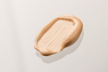 Texture of liquid foundation Background made of liquid foundation Make-up concept. Skin Tone Cream