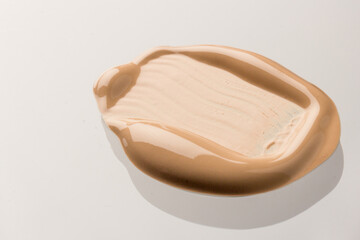Texture of liquid foundation Background made of liquid foundation Make-up concept. Skin Tone Cream