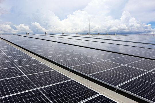 Solar PV Rooftop System on Industry Roof with Cloudy Sky