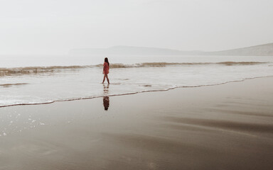 Shorelines walking, with golden light lighting up the sea and sands