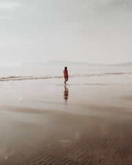 Sunday beach strolls, on empty, isolated beach