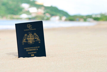 Dominica passport on the sand of the beach