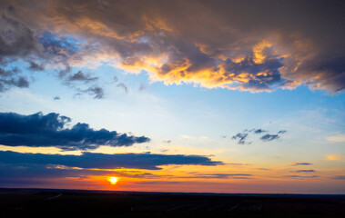 Clouds at sunset, amazing sky, nature background