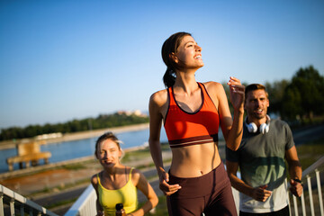 Friends fitness training together outdoors living active healthy