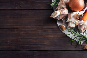 Beef bone and vegetable ingredients for cooking broth. Healthy food with collagen and amino acids. Copy space.