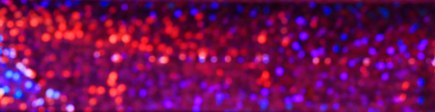 Colorful sequins, blurred abstract background